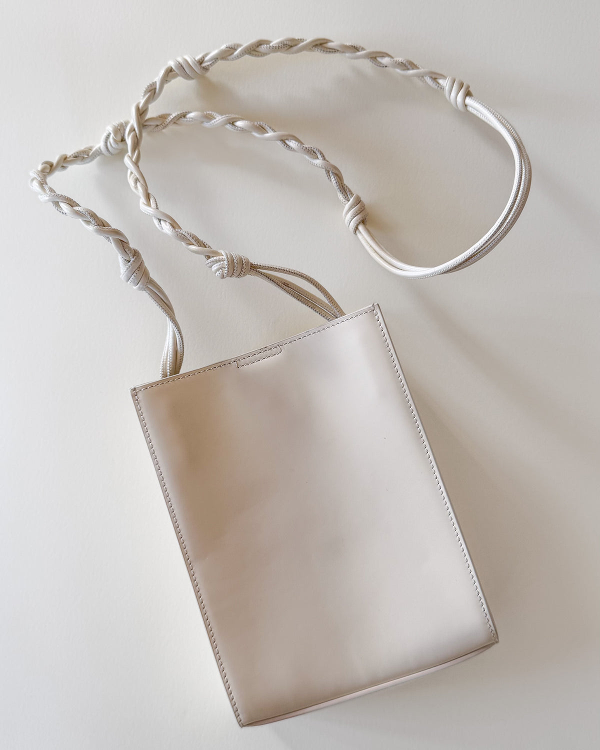 Sac Jil Sander Tangle Small – cuir blanc, bandoulière nouée à la main